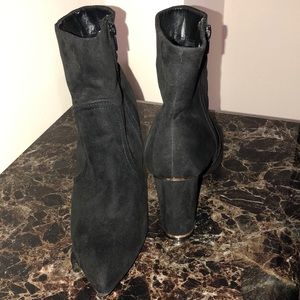 Black velvet ankle heeled booties.
